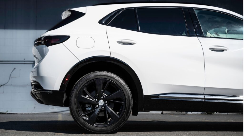 a white suv parked in a parking lot