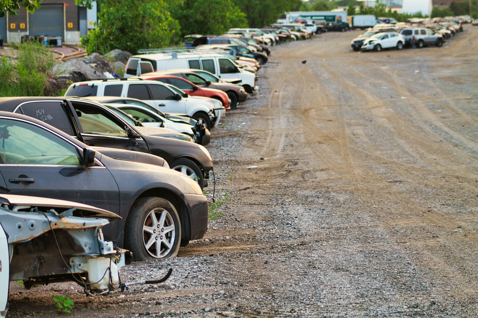 a bunch of cars that are sitting in the dirt